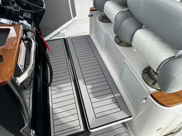  Yacht Photos Pics 2023 Everglades 395 Center Console boat interior with cushioned seating and non-slip flooring.