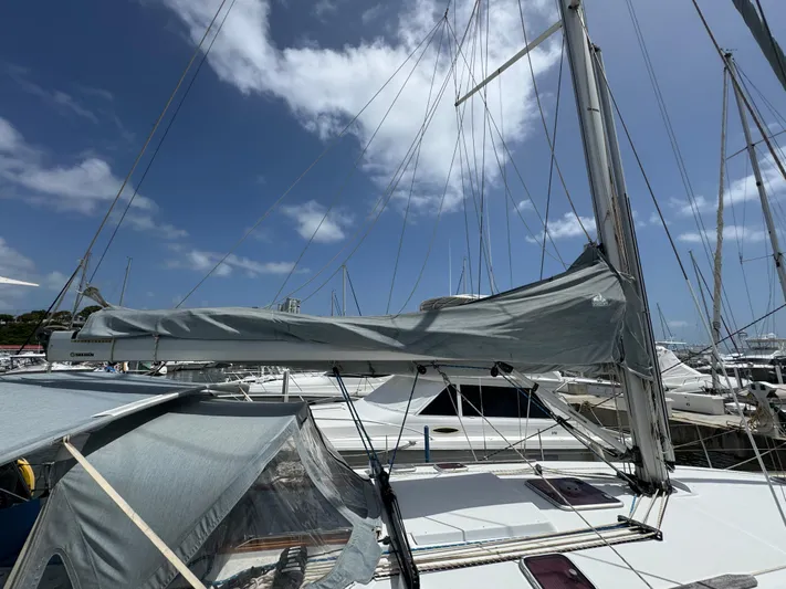 Pelican Pat Yacht Photos Pics Jeanneau Sun Odyssey 42i sailboat, 2010 model, docked under a clear blue sky.