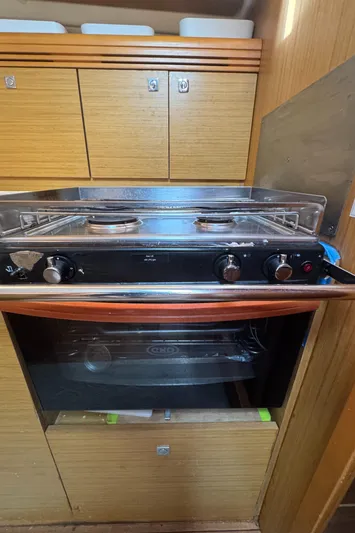 Pelican Pat Yacht Photos Pics Galley kitchen in 2010 Jeanneau Sun Odyssey 42i with stove and oven.