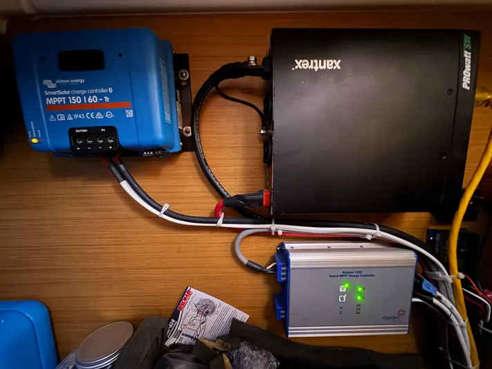 Pelican Pat Yacht Photos Pics Electrical setup on a 2010 Jeanneau Sun Odyssey 42i, featuring solar charge controllers and wiring.