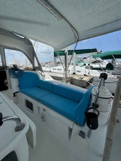 Pelican Pat Yacht Photos Pics Jeanneau Sun Odyssey 42i 2010 sailboat interior with blue seating, docked at marina.
