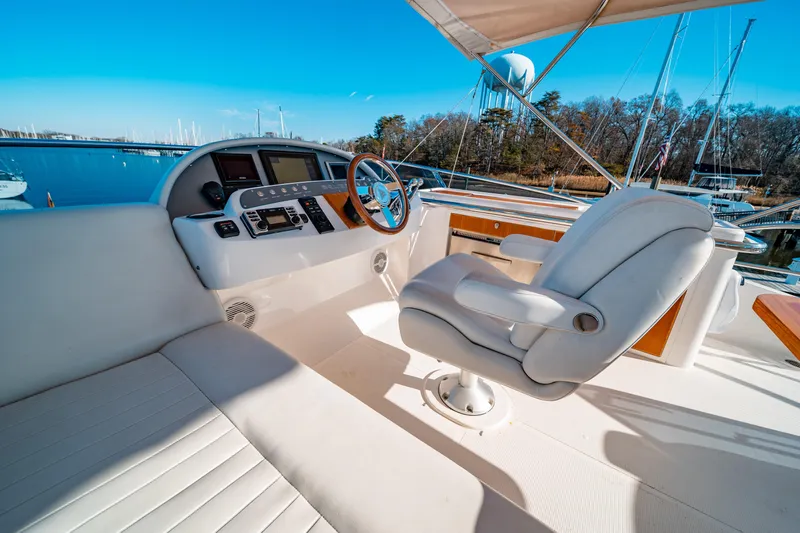  Yacht Photos Pics Luxurious helm of 2015 Belize 54 Daybridge yacht with plush seating and modern controls.