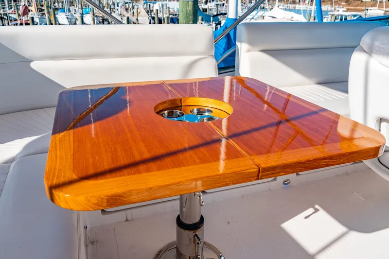  Yacht Photos Pics Luxurious wooden table on 2015 Belize 54 Daybridge yacht deck.