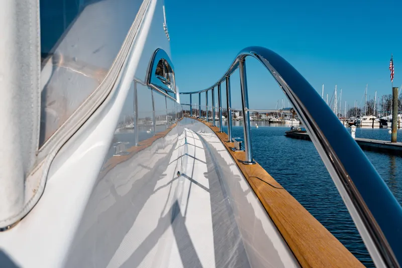  Yacht Photos Pics 2015 Belize 54 Daybridge yacht deck with marina view and clear blue sky.