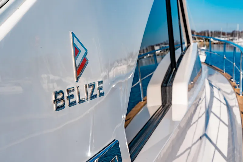  Yacht Photos Pics 2015 Belize 54 Daybridge yacht, sleek design, docked in marina, sunny day.