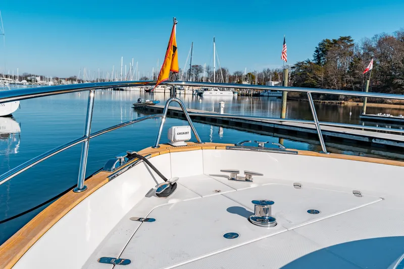  Yacht Photos Pics Bow view of 2015 Belize 54 Daybridge yacht docked in a serene marina.