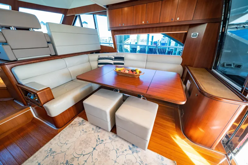  Yacht Photos Pics Luxurious interior of 2015 Belize 54 Daybridge yacht with elegant dining area.