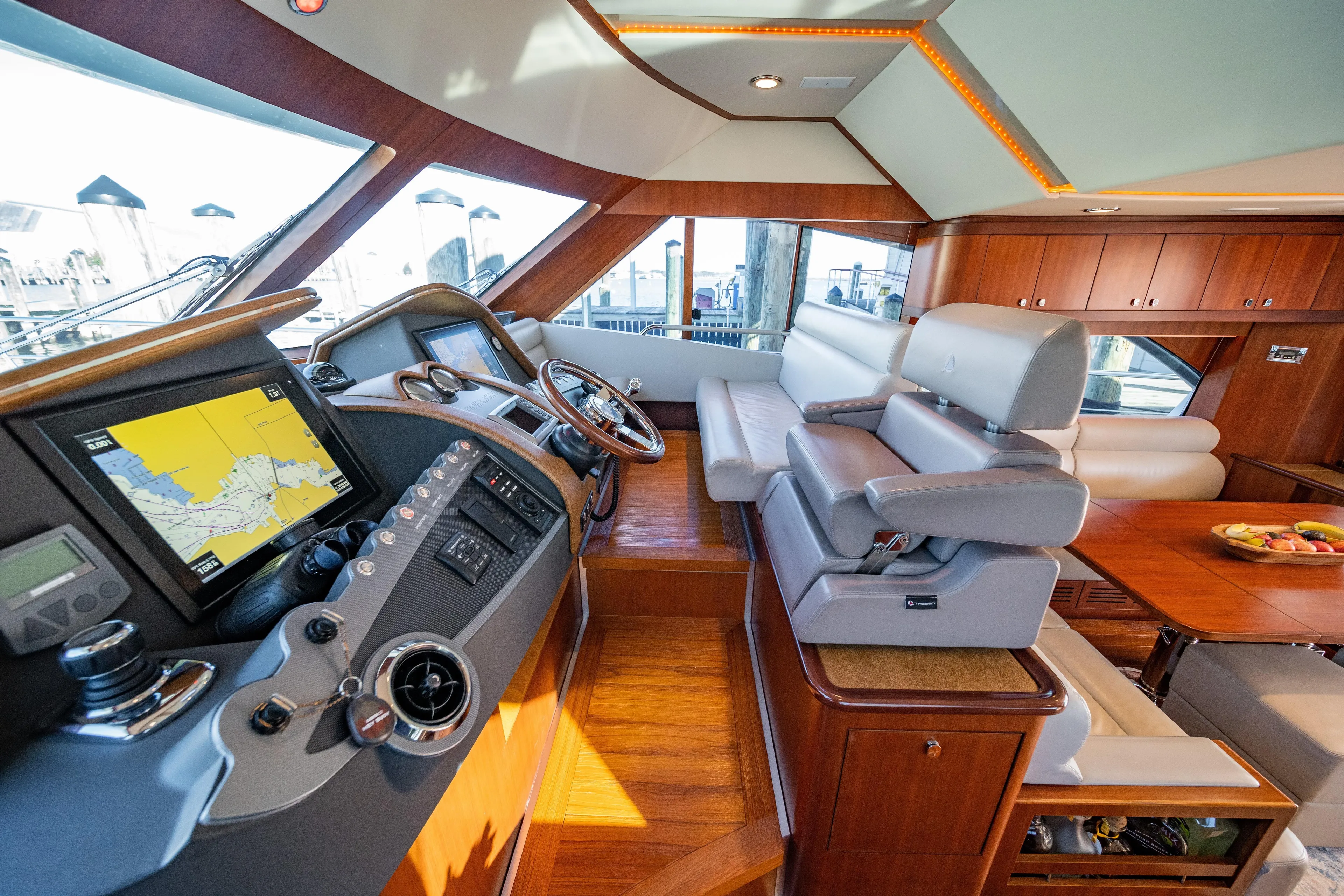  Yacht Photos Pics Luxurious interior of 2015 Belize 54 Daybridge yacht with navigation system and seating area.