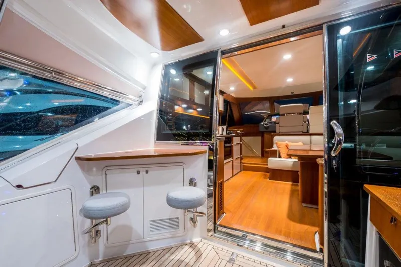  Yacht Photos Pics Luxurious interior of 2015 Belize 54 Daybridge yacht with modern seating and elegant lighting.