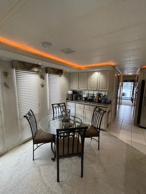Interior of 2000 Funtime 16x72 houseboat with dining area and kitchen.