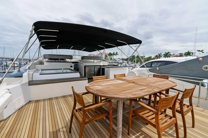 Noah's Yacht Photos Pics 2004 Ferretti Yachts 94 Motor Yacht deck with dining area and canopy.