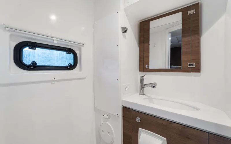 Always Sunday Yacht Photos Pics Modern bathroom in 2022 Bali 4.8 yacht with sleek sink and mirror.