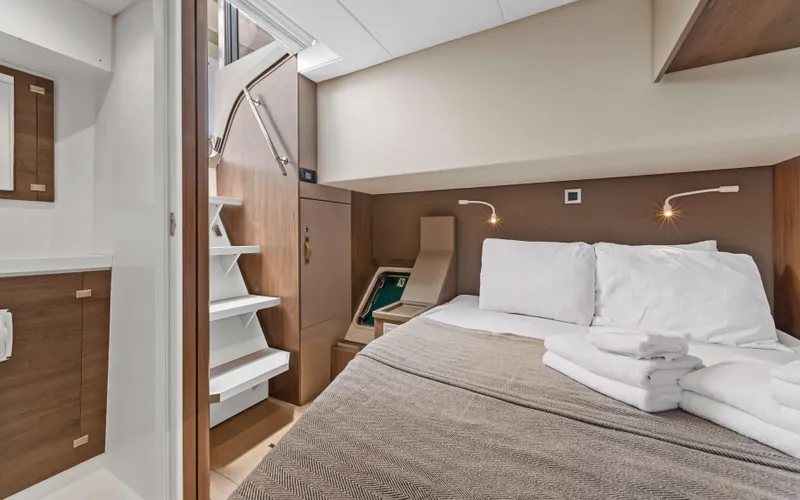 Always Sunday Yacht Photos Pics Luxurious cabin interior of 2022 Bali 4.8 yacht with cozy bed and modern design.