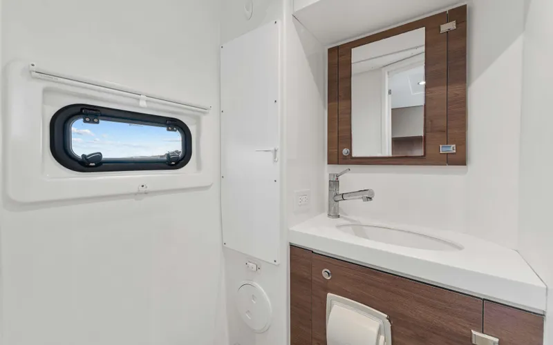 Always Sunday Yacht Photos Pics Modern bathroom in 2022 Bali 4.8 yacht with sleek sink and window view.