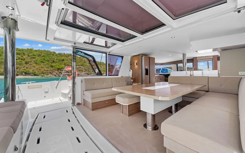 Always Sunday Yacht Photos Pics Luxurious interior of 2022 Bali 4.8 catamaran with spacious seating and scenic ocean view.