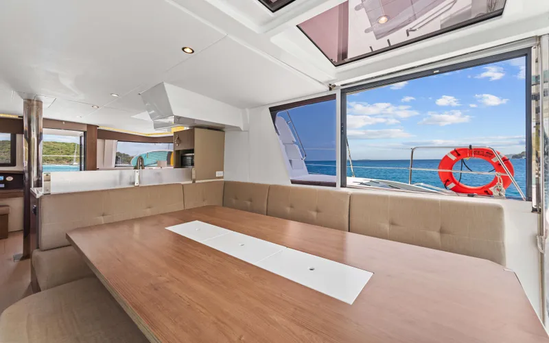 Always Sunday Yacht Photos Pics Luxurious interior of 2022 Bali 4.8 yacht with ocean view through large windows.
