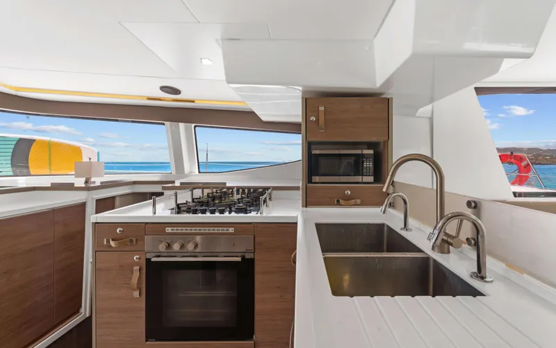 Always Sunday Yacht Photos Pics Modern kitchen interior on 2022 Bali 4.8 yacht with ocean view.