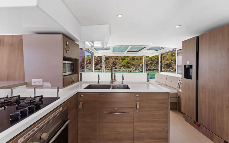 Always Sunday Yacht Photos Pics Modern kitchen interior on 2022 Bali 4.8 yacht with ocean view.