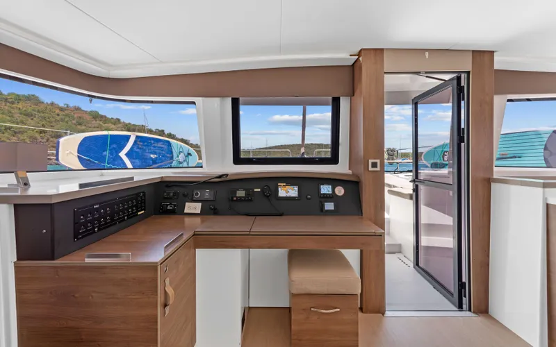 Always Sunday Yacht Photos Pics Interior of 2022 Bali 4.8 yacht with control panel and outdoor view.