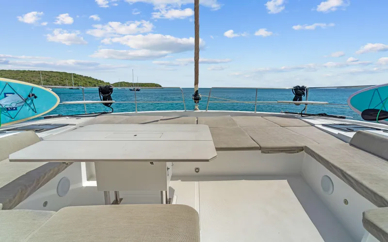 Always Sunday Yacht Photos Pics Luxurious Bali 4.8 yacht deck with seating, ocean view, and surfboards, 2022 model.