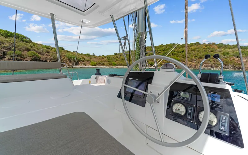 Always Sunday Yacht Photos Pics Cockpit of 2022 Bali 4.8 catamaran with scenic ocean view and modern navigation instruments.