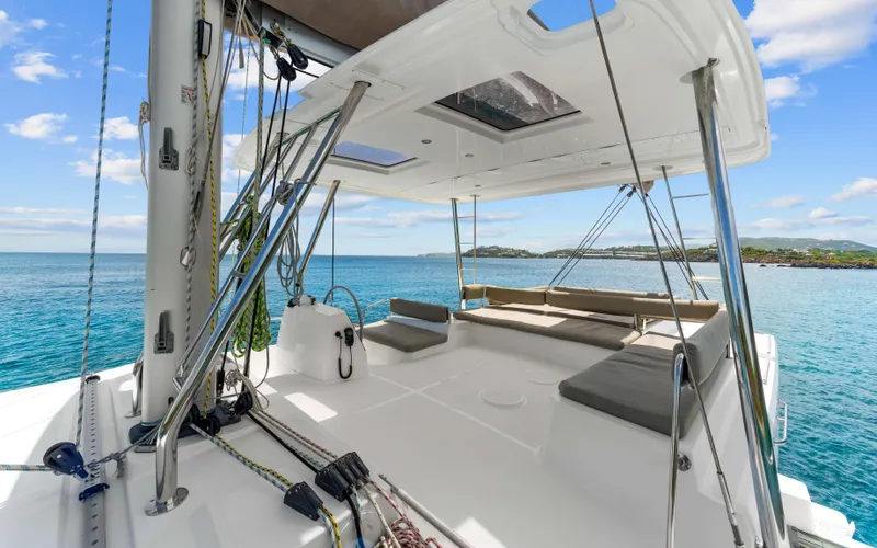 Always Sunday Yacht Photos Pics 2022 Bali 4.8 catamaran deck with ocean view, featuring seating and sailing equipment.