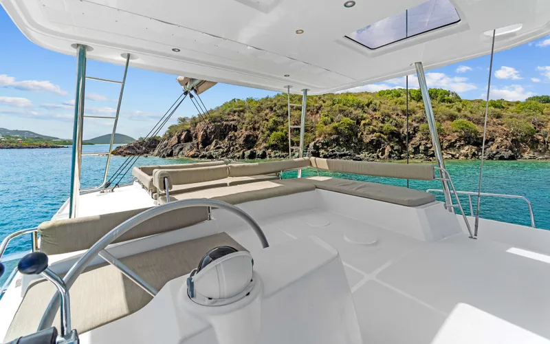Always Sunday Yacht Photos Pics Luxurious 2022 Bali 4.8 catamaran with spacious deck, scenic coastal view.