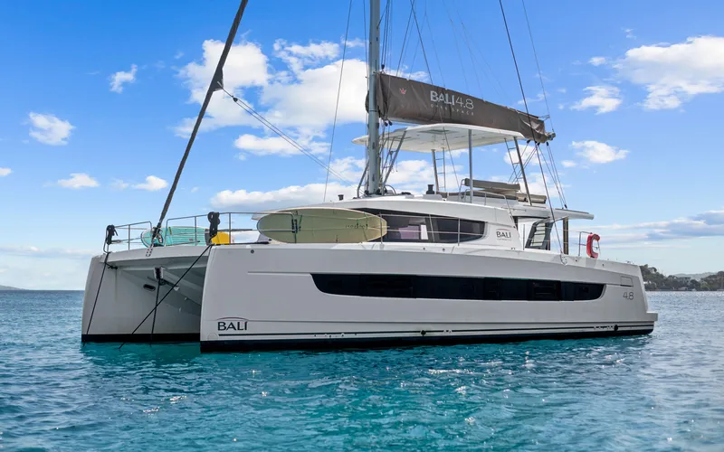 Always Sunday Yacht Photos Pics 2022 Bali 4.8 catamaran sailing on clear blue water under a sunny sky.