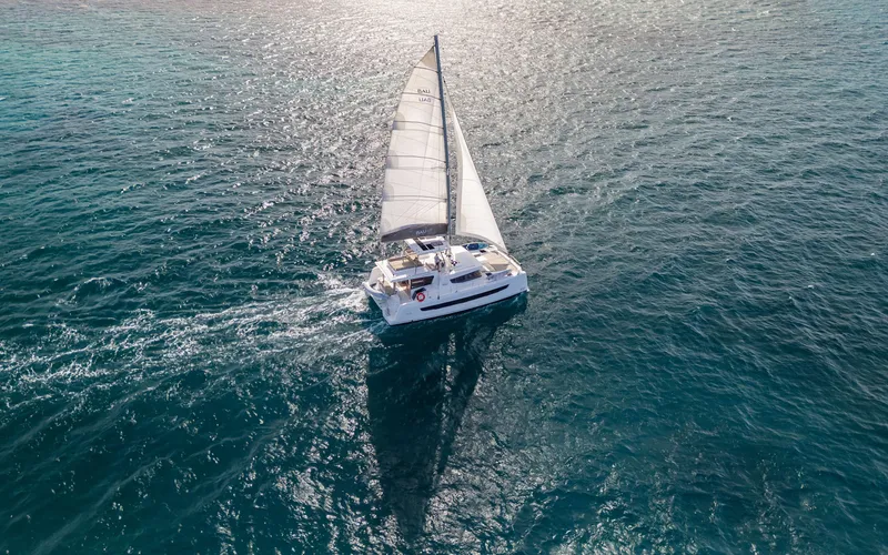 Always Sunday Yacht Photos Pics Sailing catamaran Bali 4.8, 2022 model, gliding on open sea waters.