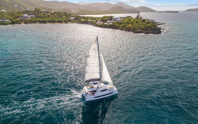 Always Sunday Yacht Photos Pics Sailing yacht Bali 4.8 (2022) cruising near a scenic coastline.