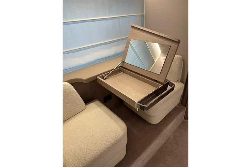  Yacht Photos Pics Luxurious interior of 2021 Azimut Fly 72 yacht with elegant seating and vanity mirror.