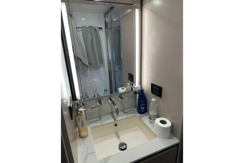  Yacht Photos Pics Luxurious bathroom in 2021 Azimut Fly 72 yacht with modern fixtures and elegant design.
