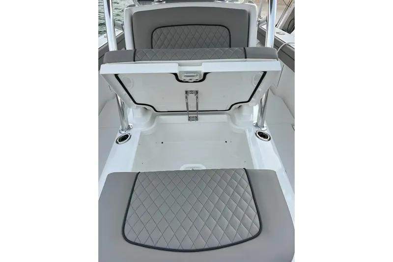  Yacht Photos Pics 2023 Valhalla Boatworks V-37 interior with open storage compartment and quilted seating.