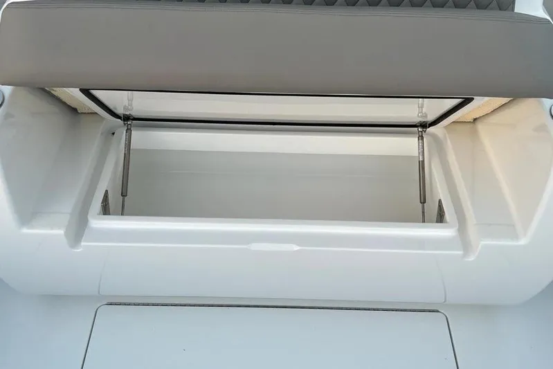  Yacht Photos Pics 2023 Valhalla Boatworks V-37 storage compartment with open lid, showcasing interior space.
