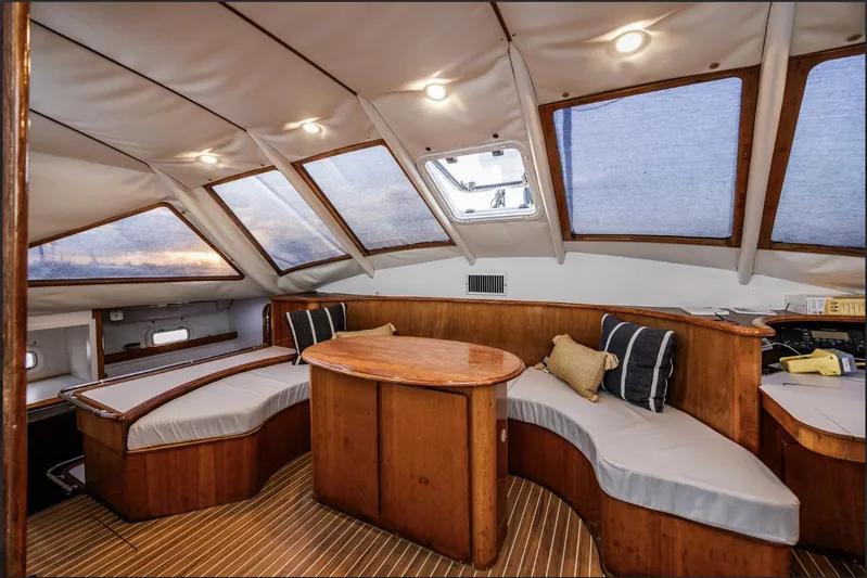 Blue Star Yacht Photos Pics Luxurious 1993 Privilege 43 yacht interior with wooden furnishings and skylights.