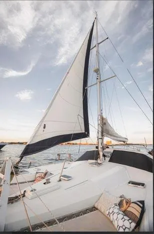 Blue Star Yacht Photos Pics Sailing yacht Privilege 43, 1993 model, on calm waters under a clear sky.