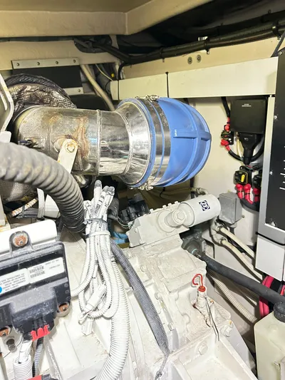 Rock It Yacht Photos Pics Engine room of 2007 Sea Ray 52 Sundancer yacht, showcasing mechanical components and wiring.