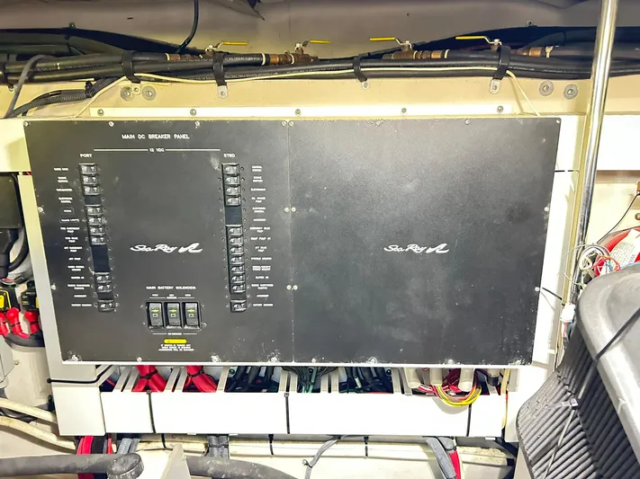 Rock It Yacht Photos Pics Electrical panel of a 2007 Sea Ray 52 Sundancer yacht, showcasing wiring and controls.