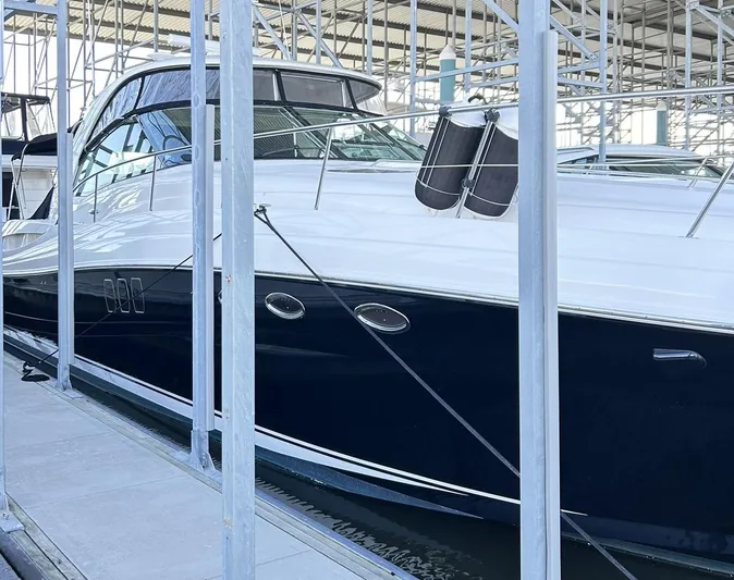 Rock It Yacht Photos Pics 2007 Sea Ray 52 Sundancer yacht docked in a marina, showcasing sleek design and luxury features.