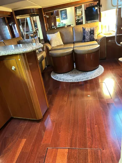Rock It Yacht Photos Pics Luxurious interior of 2007 Sea Ray 52 Sundancer with polished wood flooring and elegant seating.