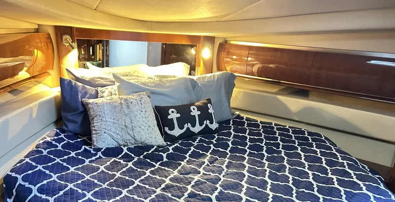 Rock It Yacht Photos Pics Luxurious cabin interior of 2007 Sea Ray 52 Sundancer with nautical-themed bedding.