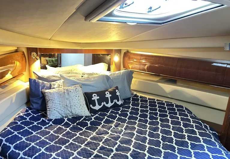 Rock It Yacht Photos Pics Luxurious cabin interior of 2007 Sea Ray 52 Sundancer yacht with nautical-themed bedding.