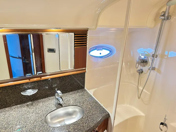 Rock It Yacht Photos Pics Luxurious bathroom interior of 2007 Sea Ray 52 Sundancer yacht with granite countertop and shower.