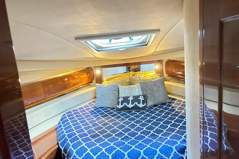 Rock It Yacht Photos Pics Luxurious cabin interior of 2007 Sea Ray 52 Sundancer yacht with elegant bedding.