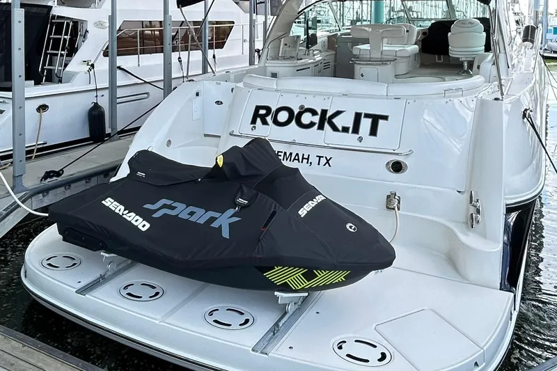 Rock It Yacht Photos Pics 2007 Sea Ray 52 Sundancer yacht with Sea-Doo Spark jet ski on the deck, docked in Kemah, TX.