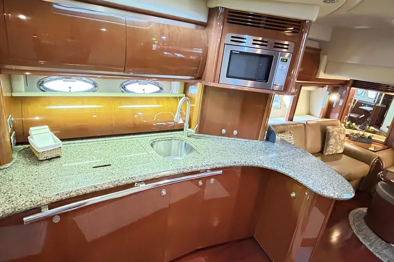 Rock It Yacht Photos Pics Luxurious 2007 Sea Ray 52 Sundancer yacht interior with modern kitchen and elegant design.