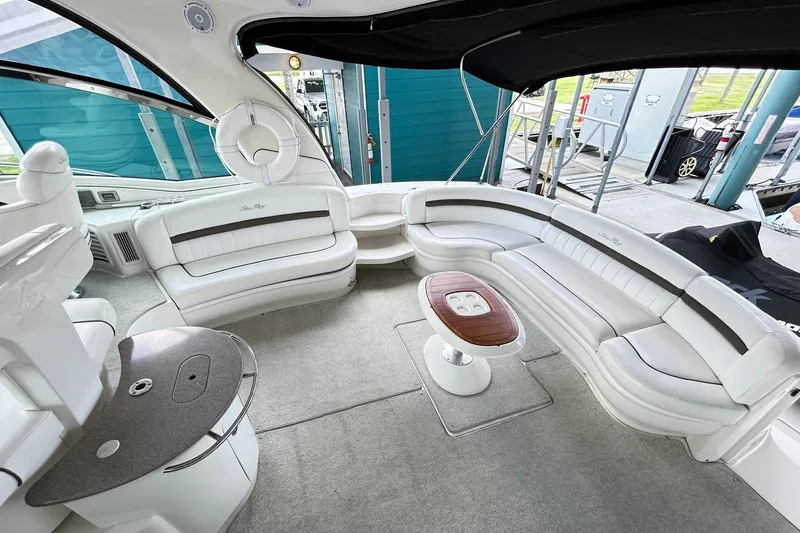 Rock It Yacht Photos Pics Luxurious interior of 2007 Sea Ray 52 Sundancer yacht with elegant seating and table.