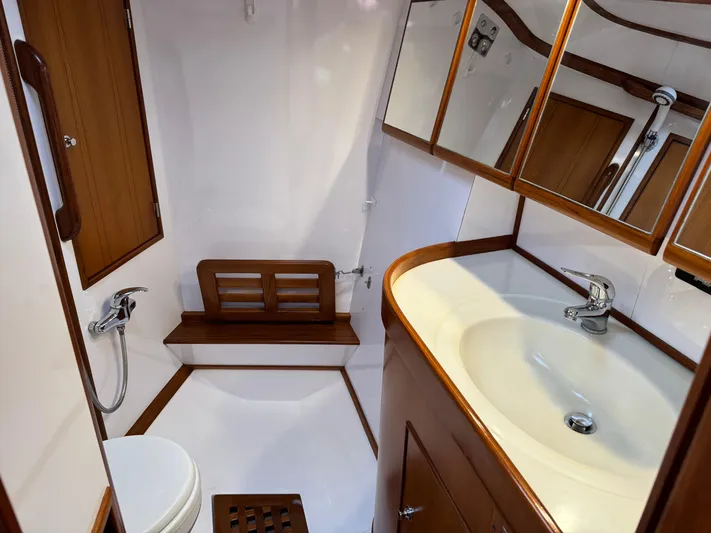 Shearwater Yacht Photos Pics 2008 Hylas 46 yacht bathroom with wooden accents and modern fixtures.