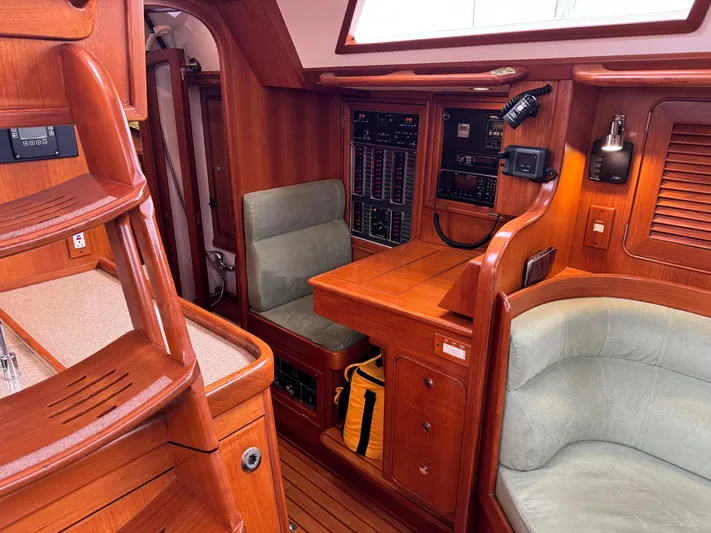 Shearwater Yacht Photos Pics Interior of 2008 Hylas 46 yacht featuring navigation station and seating area.