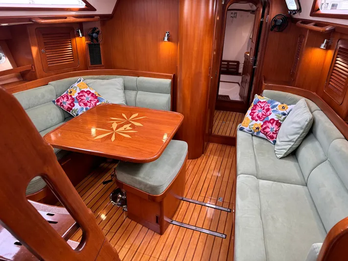 Shearwater Yacht Photos Pics Luxurious 2008 Hylas 46 yacht interior with elegant wood finish and plush seating.
